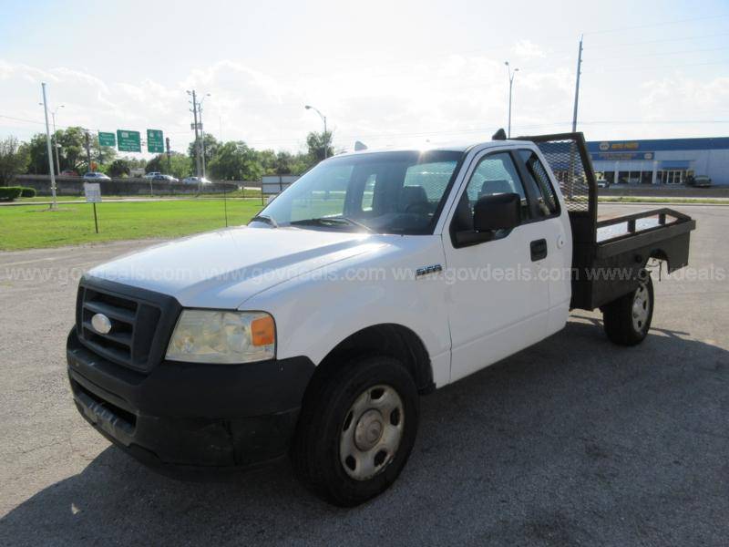 2008 Ford F-150 light duty flatbed pickup.