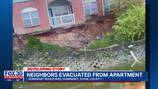 Residents displaced; apartment complex building condemned after retaining wall gives way