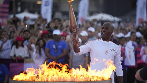 Torchbearers in Marseille kick off the Olympic flame's journey across France