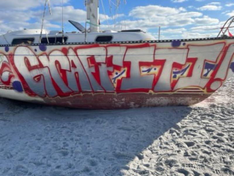 The sailboat, which washed ashore on Jacksonville Beach on Oct. 23, has become an eyesore and a target for graffiti.