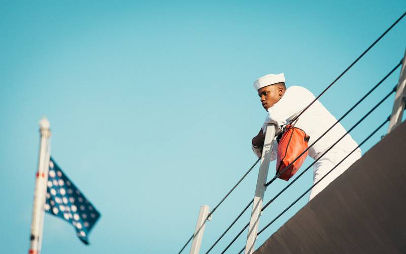 This sailor looks at family before getting ready to depart from Naval Station Mayport on USS Mason.