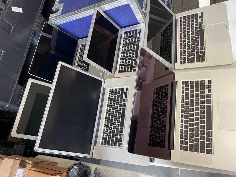 Various Apple laptops are some of the office equipment being auctioned off this weekend.