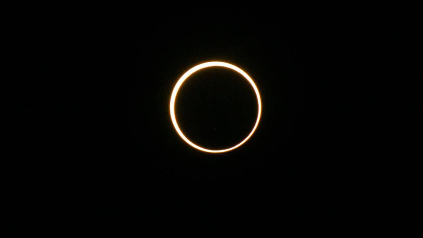KERRVILLE, TEXAS - OCTOBER 14: The moon passes in front the sun during an annular solar eclipse on October 14, 2023 in Kerrville, Texas. Differing from a total solar eclipse, the moon in an annular solar eclipse covers part of the sun's light, creating the "ring of fire" effect around the moon. (Photo by Brandon Bell/Getty Images)