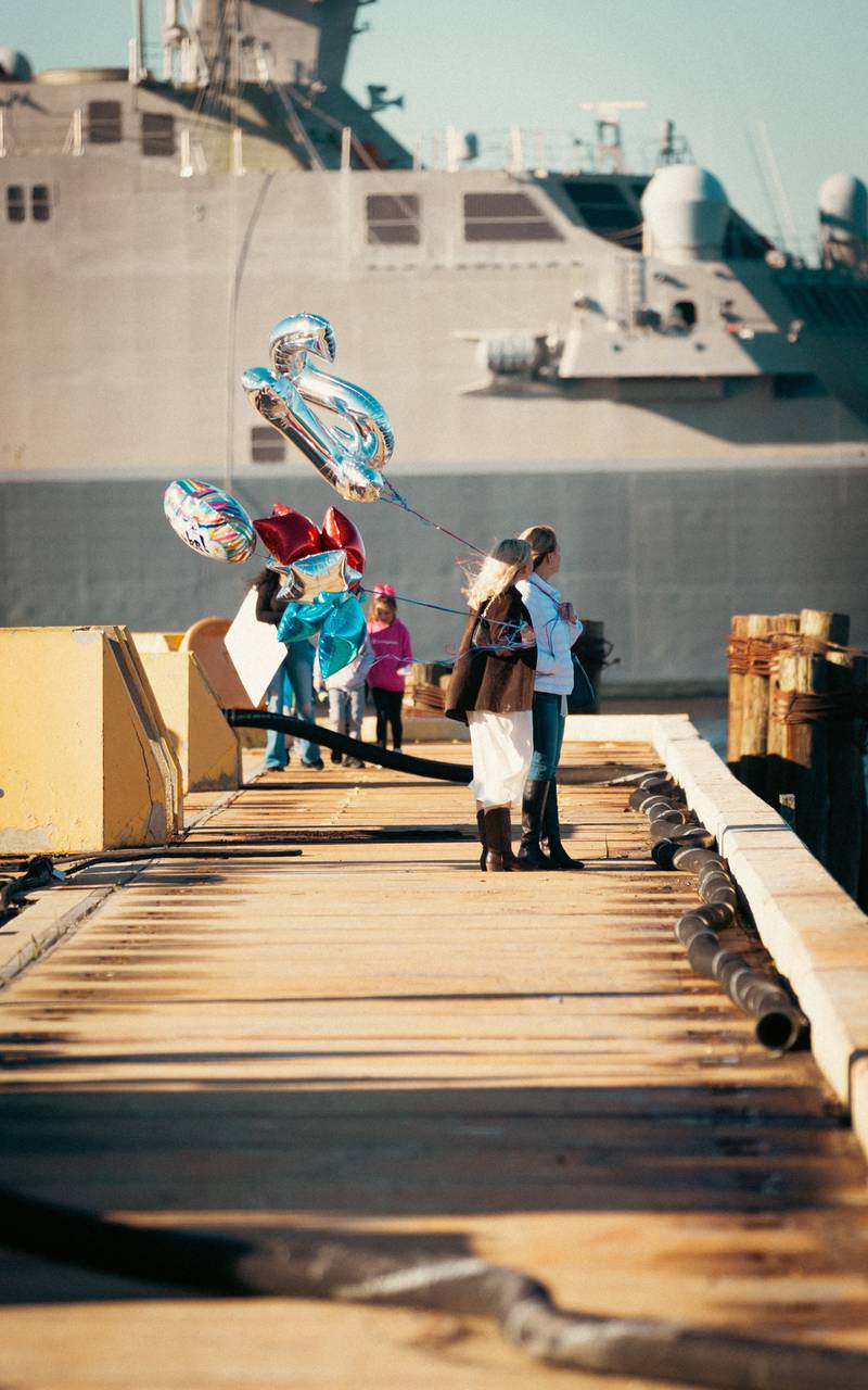 Family and friends waited to greet the crew of USS Thomas Hudner as it returned home on Thursday.