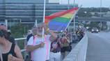 Demonstrators march across Acosta Bridge to support LGBTQ+ rights, protest Freedom Summer