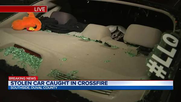 Stolen car caught in crossfire