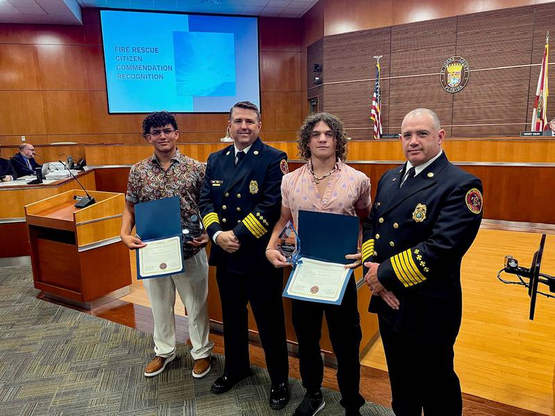 St. Johns County Fire Rescue recognized two residents for helping to save the lives of several people.