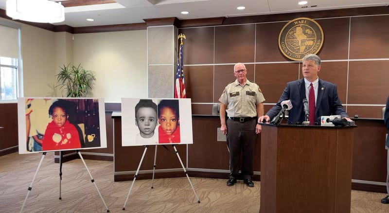 GBI Special Agent in Charge Jason Seacrist (right) and Ware County Sheriff Carl James (middle) announce that a "Baby Jane Doe" whose body was found in 1988 has been identified as 5-year-old Kenyatta Odom.