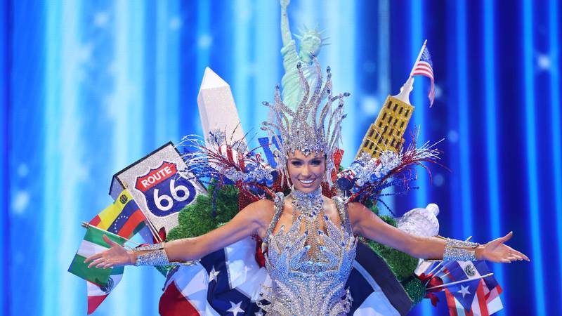 Miss USA Noelia Voigt wearing a USA-themed costume on stage.