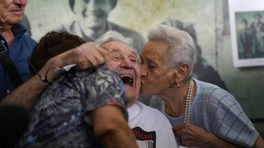 Photos: WWII vet, children he saved reunite