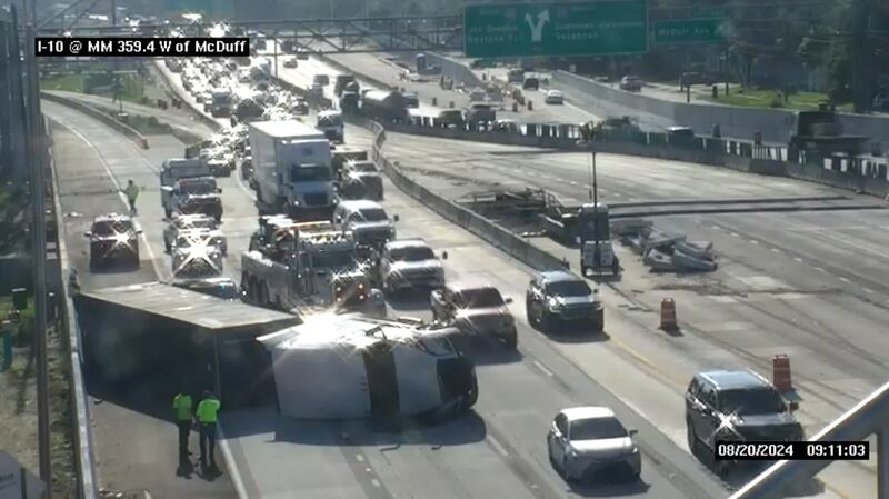 Traffic Alert: Overturned semi-truck blocking westbound lanes of I-10 at McDuff Ave.