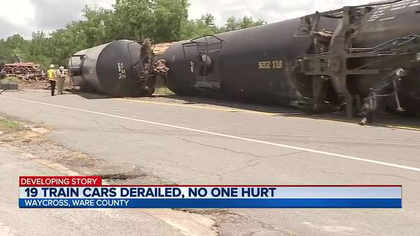 ‘I heard a loud boom’: Train derailment jolts neighbors awake, draws curious spectators