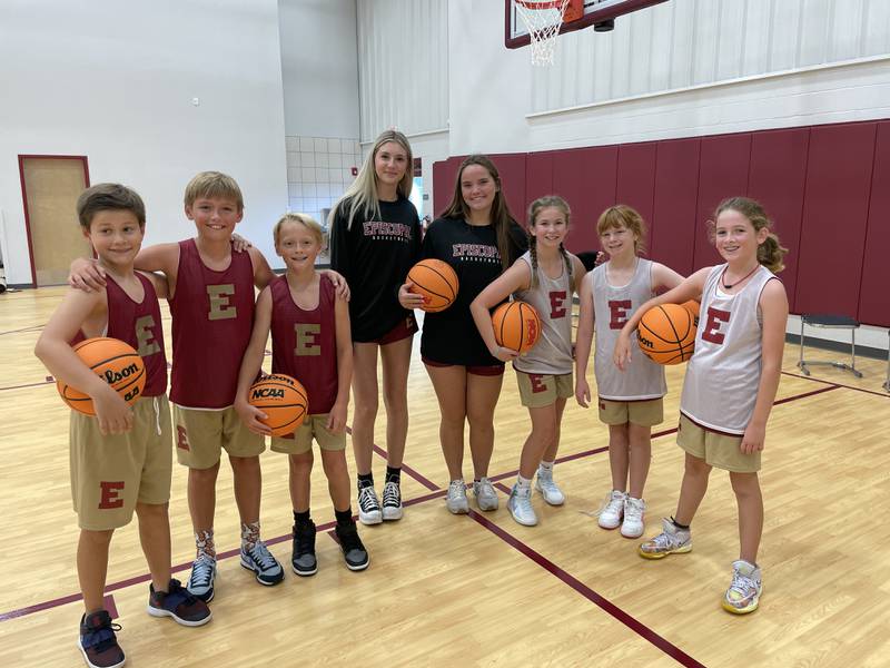 School basketball students celebrate their first games at home.