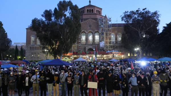 Hundreds of pro-Palestinian protesters remain on UCLA campus despite police ordering them to leave