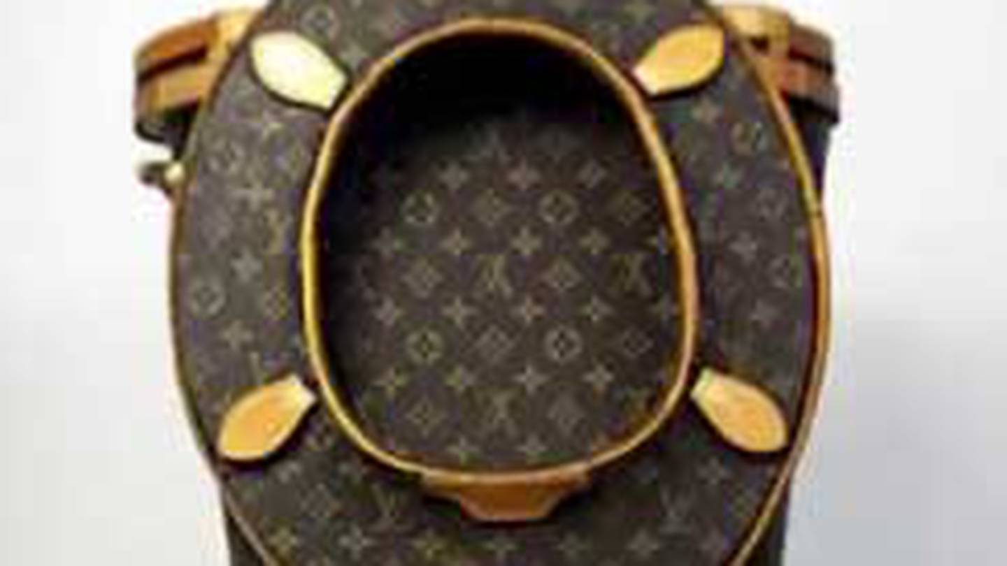 Artist creates bizarre gold plated Louis Vuitton toilet using 24