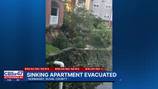 Ground appears to be collapsing around apartment building in Normandy