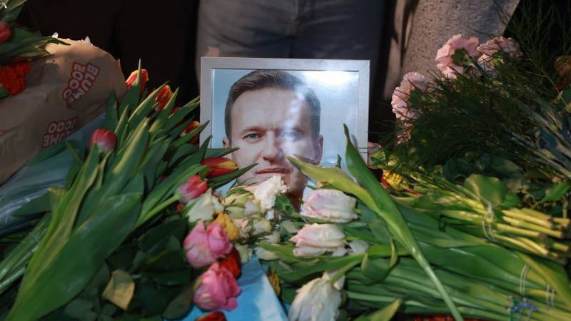 MUNICH, GERMANY - FEBRUARY 16: People lay flowers during a vigil for Alexiei Navalny in front of the Russian Consulate General on February 16, 2024 in Munich, Germany. The death of Russian opposition politician, Alexi Navalny, 47, was announced this morning by the Russian Prison Service. Alexei Anatolievich Navalny was a Russian opposition leader, lawyer, anti-corruption activist and political prisoner. Born in Butyn' in 1976, he refounded the Russia of the Future party in 2018 and organised anti-government demonstrations. He was an advocate against corruption in Russia, and against President Vladimir Putin and his government. Navalny was hospitalised in 2020 for poisoning by a novichok agent and accused President Putin of being responsible. An investigation implicated agents from the Federal Security Service. In 2022 he was jailed for nine years after a trial for embezzlement which was labelled a sham by Amnesty International. He is survived by his wife, Yulia Navalnaya and two children. (Photo by Johannes Simon/Getty Images)