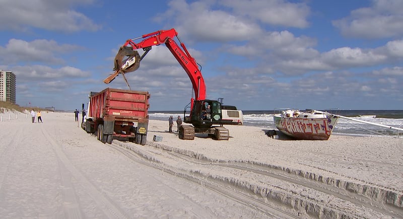 Crews came Tuesday to remove a sailboat that washed ashore on Jacksonville Beach in October.
