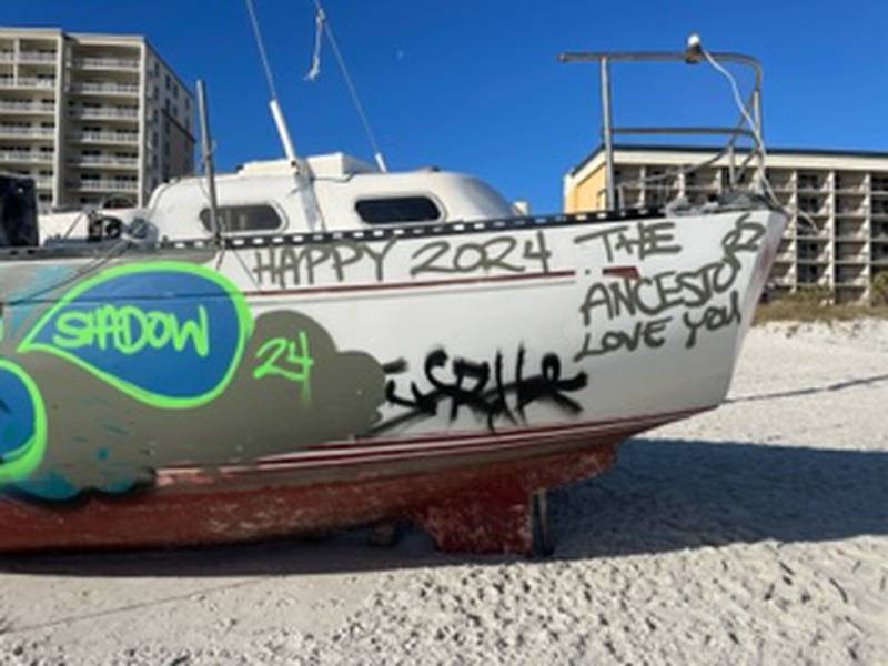 The sailboat, which washed ashore on Jacksonville Beach on Oct. 23, has become an eyesore and a target for graffiti.