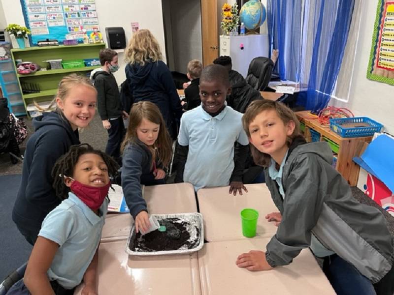 Fourth grade students construct volcanoes in science lab at The Children's Reading Center in Palatka.