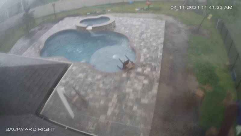 Video shows items being blown around in backyard of St. Johns County home during tornado