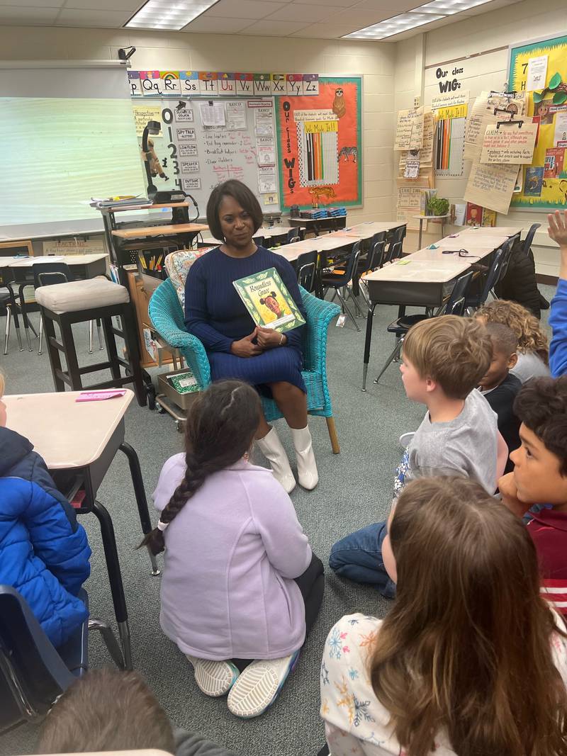 ANJ anchor Dawn Lopez reads 'Boundless Grace' to some focused students at Crown Pointe Elementary.