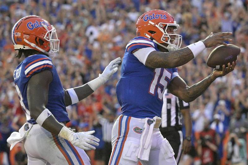 Florida tight end Keon Zipperer, left, celebrates with quarterback Anthony Richardson (15) after Richardson rushed for a touchdown during the first half of an NCAA college football game against Utah, Saturday, Sept. 3, 2022, in Gainesville, Fla.