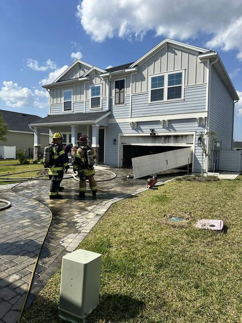 An initial report by fire rescue said the garage fire did not extend into the house.