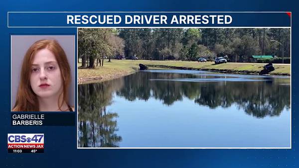 Golfers dive into pond to help driver of overturned car in St. Johns County; Driver charged with DUI
