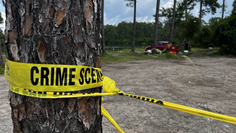 Crime scene tape can be seen at Gilligan's Island, in St. Marys, Ga.