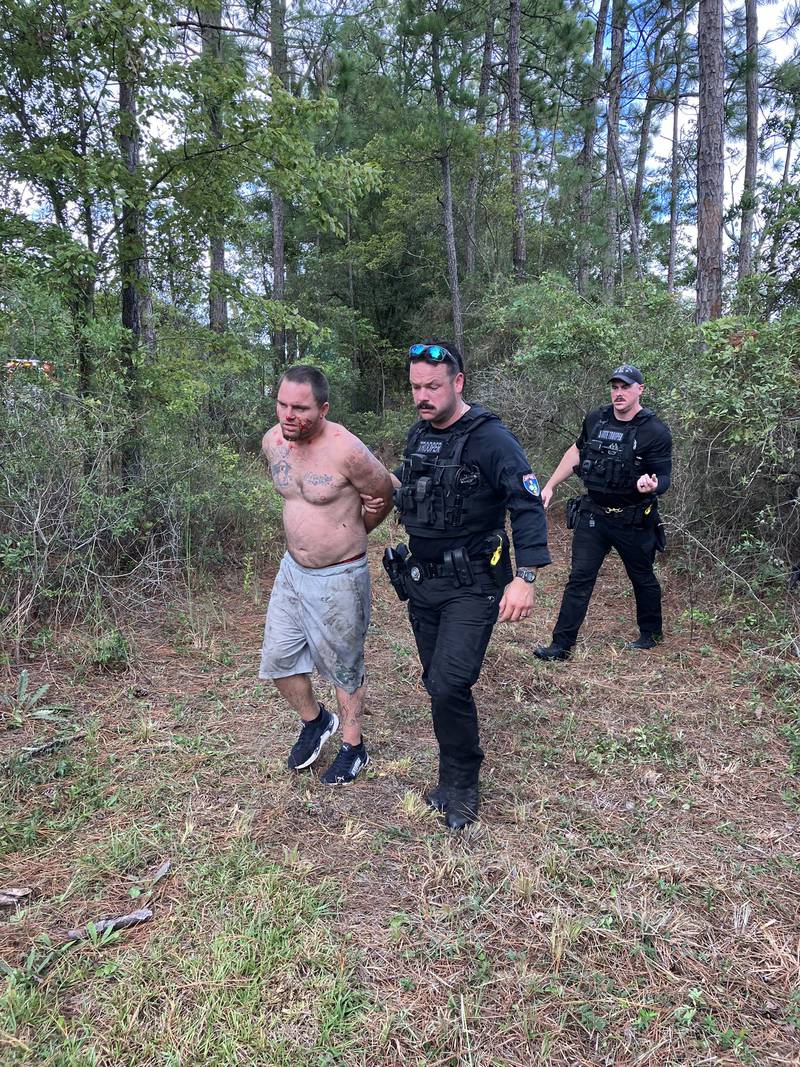 Florida Highway Patrol said it has captured an at-large suspect who ran into the woods off Interstate 10 East on Thursday morning.