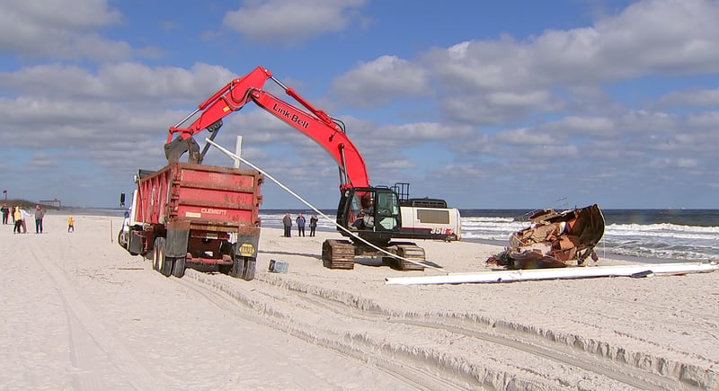 Crews came Tuesday to remove a sailboat that washed ashore on Jacksonville Beach in October.