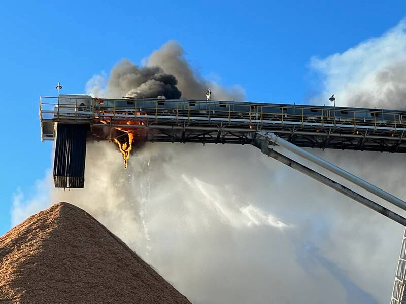 A fire suppression system was activated by mill workers in an attempt to contain the fire.