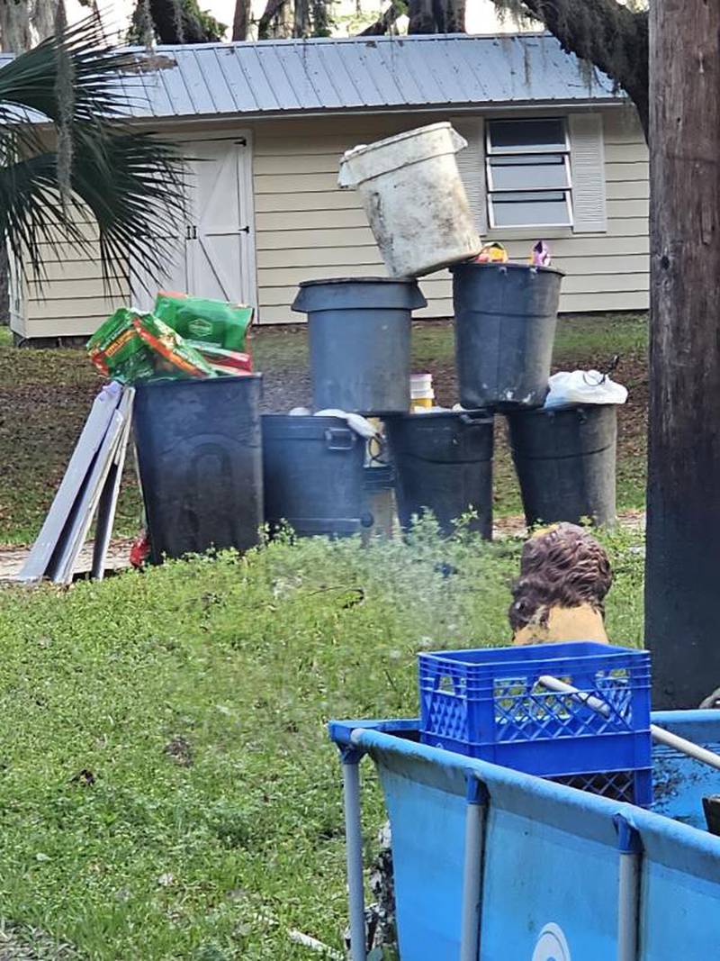 Every week, she turns the seven trash cans at her Crescent City home into a tower as part of a game with her garbage collectors.