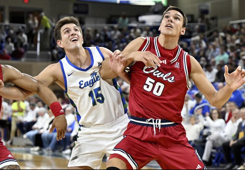 Florida Atlantic's Vladislav Goldin (50) fights for rebounding position against Florida Gulf Coast's Blaise Vespe (15) in the first half of an NCAA college basketball game, Saturday, Dec. 30, 2023, in Fort Myers, Fla. (AP Photo/Chris Tilley)