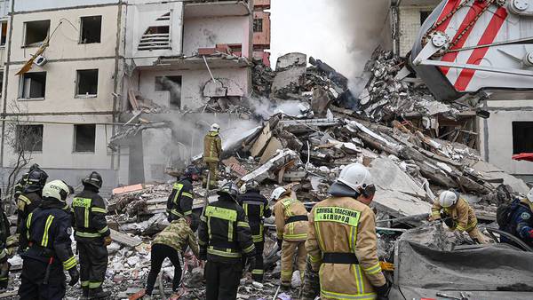 An apartment building partially collapses in a Russian border city after shelling. At least 8 killed