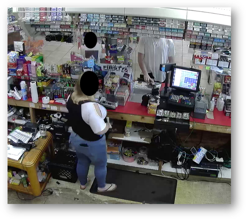 Amrine, child, and clerk during the robbery of Blue Store on Aug. 19, 2021.