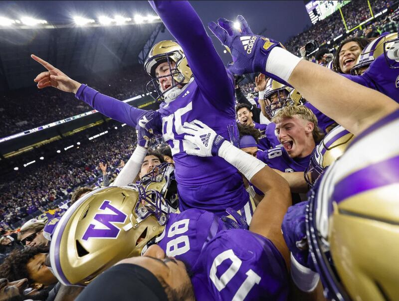 Washington's Grady Gross is carried off the field after kicking the winning field goal against Washington State during an NCAA college football game Saturday, Nov. 25, 2023, in Seattle. (Dean Rutz/The Seattle Times Via AP)