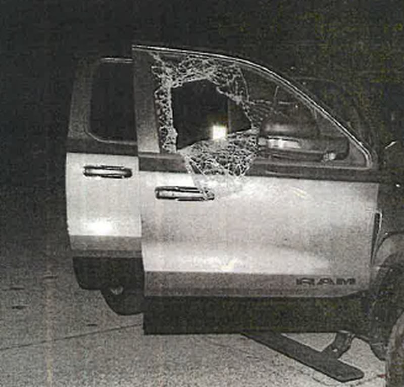 Window of Stermon's Ram truck shattered by the deadly bullet that killed him.