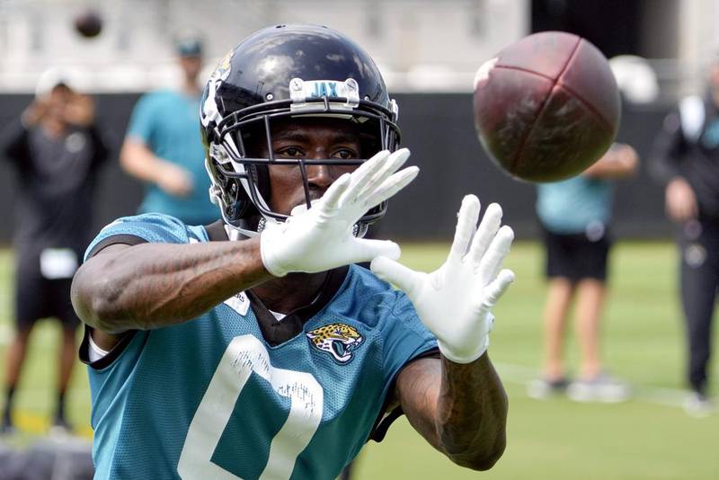 Jacksonville Jaguars wide receiver Calvin Ridley (0) catches a pass during an NFL football practice, Monday, June 5, 2023, in Jacksonville, Fla.