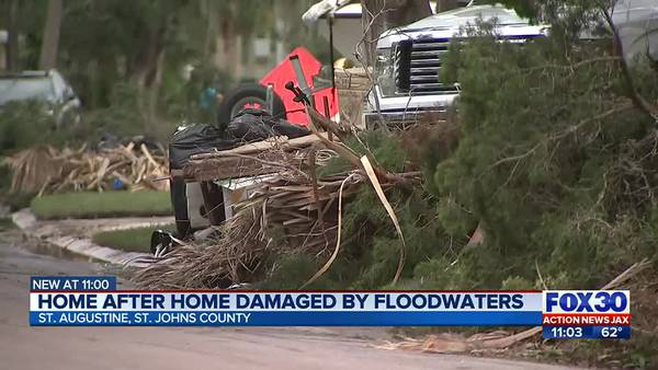Home after home damaged by floodwaters