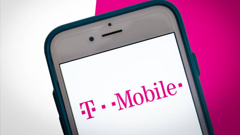 The logo of T-Mobile on smartphone screen on Two Tone Color background. Vivid and fresh color concept.