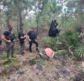 Florida Highway Patrol said it has captured an at-large suspect who ran into the woods off Interstate 10 East on Thursday morning.