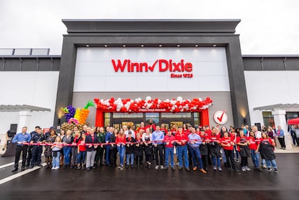 Ribbon cutting ceremony before the doors opened at Grand Cypress location on Wed., Dec. 14.