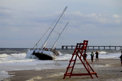 A sailboat got stuck on shore on Jacksonville Beach near 15th Avenue North near the Hampton Inn Jacksonville Beach/Oceanfront in the area of 1st Street North on Monday evening, 10/23/23.