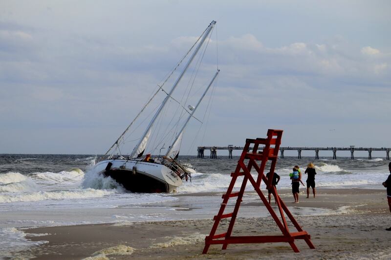 A sailboat got stuck on shore on Jacksonville Beach near 15th Avenue North near the Hampton Inn Jacksonville Beach/Oceanfront in the area of 1st Street North on Monday evening, 10/23/23.