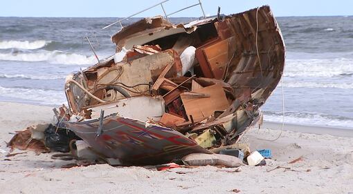 Crews came Tuesday to remove a sailboat that washed ashore on Jacksonville Beach in October.