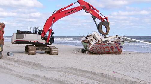 Crews came Tuesday to remove a sailboat that washed ashore on Jacksonville Beach in October.