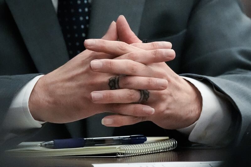 Defendant Mario Fernandez Saldana folds his hands showing his two tattooed rings while listening to Judge London Kite as she read instructions to potential jurors during his murder trial Monday, August 10, 2026 at the Duval County Courthouse in Jacksonville, Fla.  [Doug Engle/Florida Times-Union]