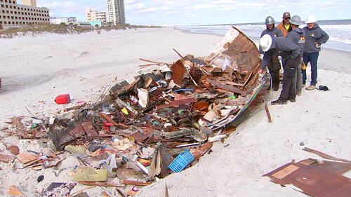 Crews came Tuesday to remove a sailboat that washed ashore on Jacksonville Beach in October.